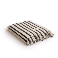 a black and white striped towel on a white background