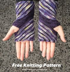 two hands with purple and yellow knitted gloves