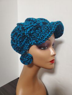 Handmade Newsboy Hat Crochet Slouchy Adult  Beanie Hat with Visor with matching earrings      Add a touch of hipster and boho style to your wardrobe with this handmade newsboy hat. The black and sapphire striped pattern is perfect for a casual occasion, and the crochet fabric type makes it suitable for any season - winter, summer, fall, or spring. The beanie hat features a visor and comes in one size, making it easy to wear for any women. In addition to the hat, it also comes with crochet earrings, adding an extra accessory to your look. This newsboy hat is not just a fashion statement, it is also made with quality acrylic material ensuring its durability for years to come. Get this unique American 20s style newsboy hat and elevate your accessory game. Blue Bohemian Crochet Hat Adjustable, Blue Adjustable Bohemian Crochet Hat, Adjustable Blue Bohemian Crochet Hat, Adjustable Bohemian Crochet Hat In Blue, Handmade Hats With Ear Flaps, One Size, Casual Handmade Hats With Ear Flaps, Newsboy Hat Crochet, 20s Style, Newsboy Hat