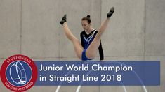 a woman is doing a trick on a trampoline in front of a wall