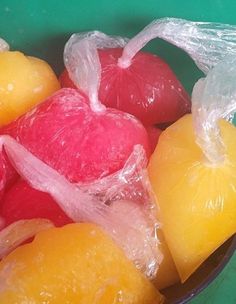 a bowl filled with fruit wrapped in plastic