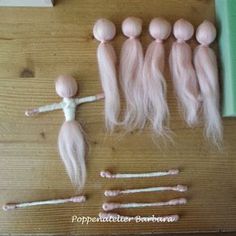 the doll is made up of pink wigs and long blonde hair, along with other dolls