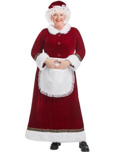 an older woman dressed as santa claus holding a white bucket and wearing a red dress