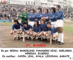 a group of soccer players posing for a photo in front of an audience at madrid