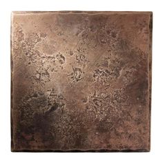 a square metal plate with brown pattered paint on it