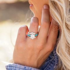 a close up of a person wearing a ring