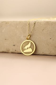 Gold Wolf Pendant - howling wolf Gold Necklace ● Material of pendant: Solid Gold 14k ( REAL GOLD ) ● Metal Stamp: 14k ( REAL GOLD ) ● The pendant is available in 5 sizes: - 12,7 mm / 0.5 inches (Diameter) - 14,0 mm / 0,55 inches ( Diameter ) In the photos - 15,3 mm / 0.6 inches ( Diameter ) - 16,5 mm / 0,65 inches ( Diameter ) - 19,1 mm / 0,75 inches ( Diameter ) ( In the photos the size is 14mm / 0.55 inches Diameter ) ( Jump Ring inner diameter: 4 mm ) ● Material of chain: Solid gold 14k ( REA Round Wolf Design Jewelry Gift, Wolf Design Round Jewelry Gift, Wolf Necklace, Wolves Pendants, Wolf Howling, Coin Necklace, Custom Necklace, Animal Jewelry, Metal Stamping