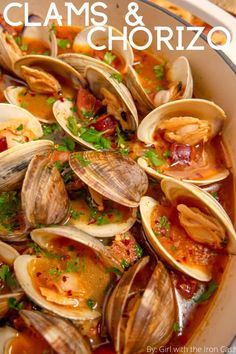 clams and chorizo in a white bowl