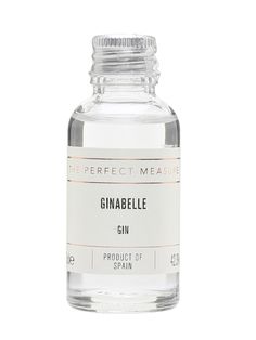 the perfect measure gin bottle with pink liquid in front of a white background, on top of