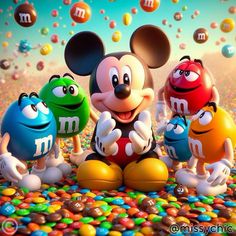 mickey mouse and other cartoon characters in front of candy candies with the word m on them