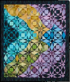 a colorful quilt with an abstract design on the front and back side, which is made up of many different colored squares