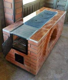 an oven built into the side of a brick wall