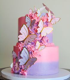 Pink and purple butterfly theme cake Pink And Purple 2 Tier Cake, 2 Tier Birthday Cake Butterfly, Purple And Gold Butterfly Birthday, 2 Tier Butterfly Cake Ideas, Butterfly Cake Ideas 1st Birthday, Pink Purple And White Cake, Encanto Two Tier Cake, Beautiful Sheet Cakes Birthday, Pastel Butterfly Cake 2 Tier