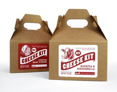 two boxes that have cheese kits in them