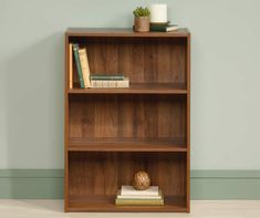 a bookshelf with three shelves on each side and one shelf holding several books