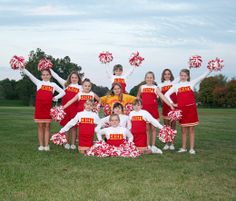 a group of cheerleaders posing for a photo