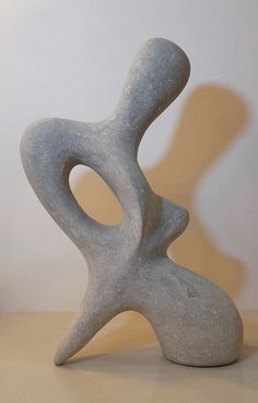 a white sculpture sitting on top of a table