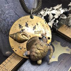 Vintage Seaturtle and Shell Necklace  #steampunkfashion #artjewelry #madhatter #vintagejewelry #handmadejewelry #upcycle #mythological #gothicfashion #uniquejewelry #localartist Clay Turtles, Moon Goddess Necklace, Sea Turtle Necklace, Steam Punk Jewelry, Industrial Jewelry, Goddess Necklace, Steampunk Necklace, Turtle Necklace, Antique Watches