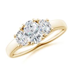 three stone diamond ring in yellow gold with diamonds on the sides and an oval shaped center