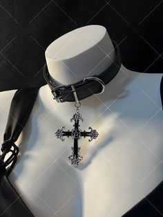 Embrace the edgy and punk vibe with our dark punk cross choker. This unique choker exudes a gothic and alternative aesthetic, perfect for expressing your individuality and subculture style. The choker features a striking cross pendant, adding a bold statement to your look.   Please note that this product includes one choker only. Affordable Metal Punk Choker, Adjustable Gothic Choker For Alternative Fashion, Grunge Choker For Cosplay, Gothic Choker For Concert, Silver Gothic Choker For Concert, Gothic Choker For Halloween Concert, Gothic Choker For Halloween And Alternative Fashion, Emo Choker For Alternative Fashion, Edgy Black Choker For Alternative Fashion