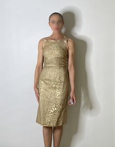 "An exceptional Y2K designer vintage dinner or cocktail dress in gold.  The fabric here is so unique - it is textured and there are panels of different plain textured metallic fabric. Amazing details and elegant classic silhouette.  Size  12 1/4\" waist 38 1/4\" long  XXS  Condition Worn seldom, light pilling very occasional seen on close up examination only. Presents beautifully.  Model is  24\" waist 5' 6\" 54kg SHIPPING PLEASE READ This item is located in Australia - we charge only the actual postage cost to send internationally. Once any item is sent if the postage charged is higher than we paid we will refund any difference. In most cases the postage cost will be higher than our postal charges - the fact is that postage is expensive and international postage for garments or heavier it Gold Evening Dress, Vintage Dinner, Gold Evening Dresses, Gold Lame, Dress Gold, Metallic Fabric, Dress Cocktail, Designer Vintage, Wiggle Dress