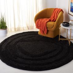 a living room with a chair and rug