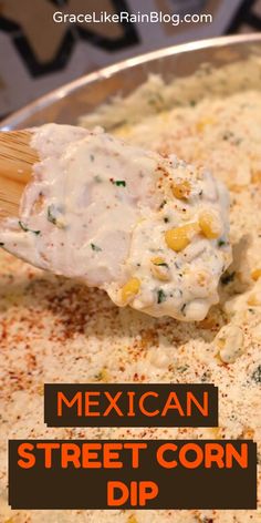 mexican street corn dip in a silver bowl with a wooden spoon and text overlay that reads, mexican street corn dip