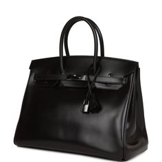 This rare SO BLACK Birkin is in Black box leather with black PVD hardware and has tonal stitching, front flap, two straps with center toggle closure, clochette with lock and two keys, and double rolled handles.The interior is lined with black chevre and has one zip pocket with an Hermes engraved zipper pull and an open pocket on the opposite side.Collection: O squareOrigin: FranceCondition: - Mint. The bag retains its structure and the exterior leather is clean with minor signs of wear. The hard