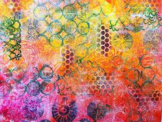 an abstract painting with lots of different colors and patterns on the surface, including circles