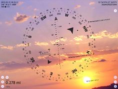 the sun is setting and there are many clocks in the sky with numbers on them