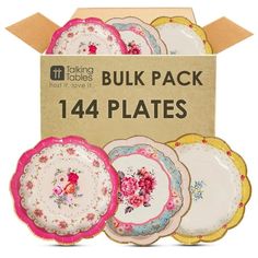 six plates in a cardboard box with floral designs