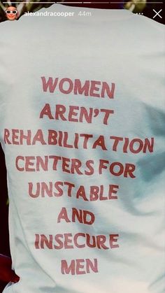 the back of a woman's t - shirt that reads women aren't rehabiltaton centers for unstable and insecure men