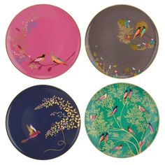 four plates with birds painted on them in different colors and designs, one is pink, the other is blue