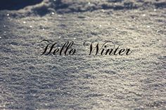 the words hello winter written in snow