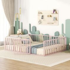 a baby's room with two cribs in it