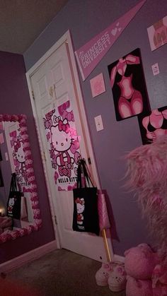 a hello kitty themed bedroom decorated in pink and purple