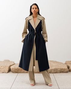 The Bricolage Trench Coat¬¨‚Ä†is constructed from a deconstructed trench coat, making it in shape of a coat again. The body layer of the coat comes in beige, and it comes with navy front pieces layered on top suggesting as 2-pieces of trench coat is combined. Comes in classic trench coat silhouette in longer length, and retaining trench-specific details such as epaulettes and sleeve straps, yet the style is updated into a modern look with dynamic sleeve drapes and the shaping at the waist. Butto Look Working Girl, Resort 2023, Classic Trench Coat, Elegante Casual, Looks Black, Abayas Fashion, Trench Coats Women, Coat Fashion, Winter Fashion