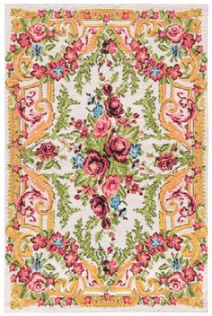 a colorful rug with flowers and leaves on the bottom in yellow, pink, green, red