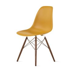 a yellow plastic chair with wooden legs