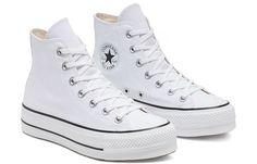 a pair of white converse sneakers with black and white laces on the bottom, side view