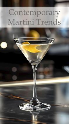 a close up of a martini in a glass on a table with the words contemporary martini trend