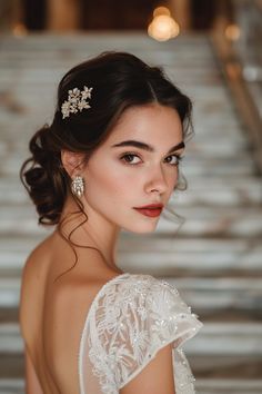 a woman wearing a wedding dress and hair comb