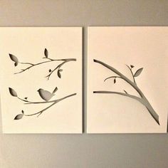 two pieces of paper with birds sitting on branches next to each other in front of a white wall