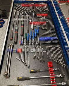 a tool box filled with lots of tools and screwdrivers on top of it