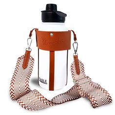 a white and brown water bottle with a strap around it