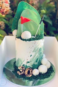 a golf themed birthday cake on a table