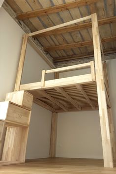 an unfinished bed frame in the corner of a room