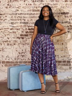 Discover elegance with our chic Plus Size Purple Print Elastic Waist Pocket Midi Skirt. This stylish skirt features a bold purple geometric print that adds a touch of modern flair to any outfit. The elastic waistband ensures a comfortable and secure fit, while the midi length offers a flattering silhouette for all body types. Designed with convenience in mind, this skirt includes practical side pockets, perfect for carrying your essentials without compromising on style. The flowy A Line shape pr