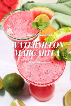 two glasses filled with watermelon margarita next to limes