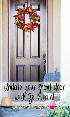 the front door is decorated with fall leaves